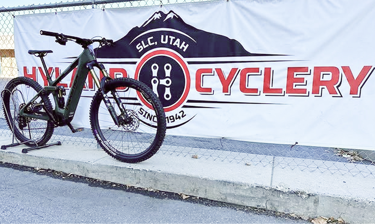 Hyland Cyclery fence banner