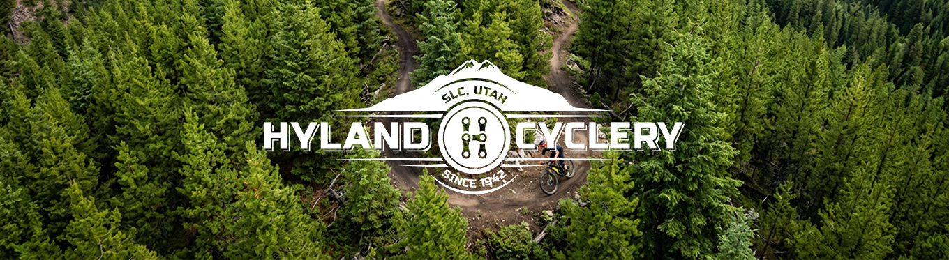 Hyland Cyclery logo over trailhead