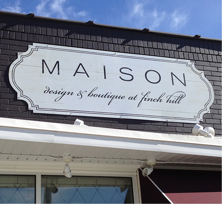 Maison building sign